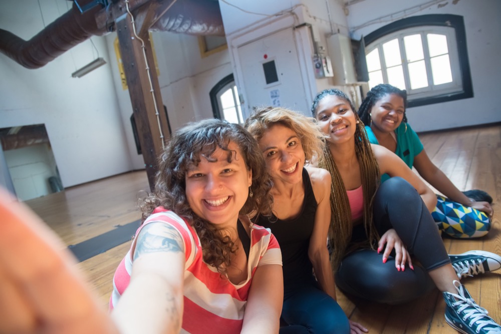 Four friends taking a selfie together
