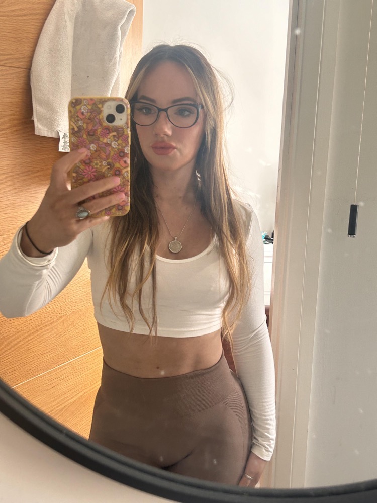 Mirror selfie in warm natural light